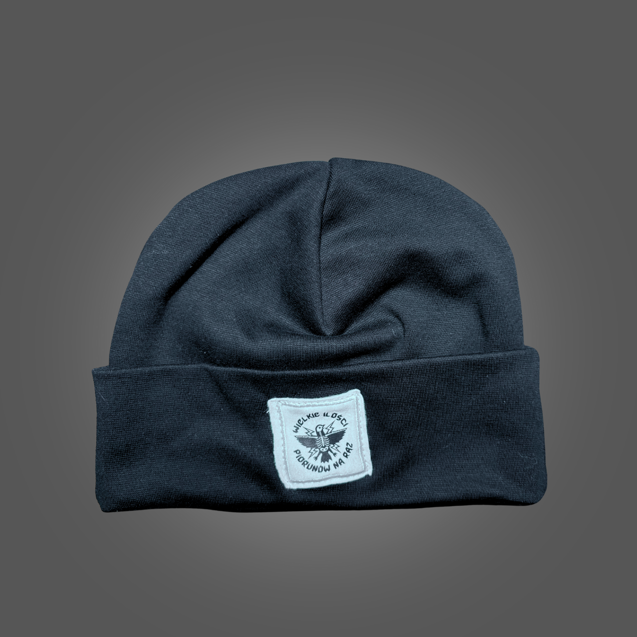 Czapka z białą naszywką z ptakiem